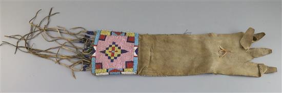 A Native American buckskin and beadwork gauntlet, Northern Plains, 19th century, Approx 45cm